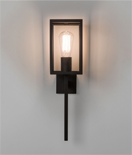 Contemporary coach lantern with a black metal frame and clear glas