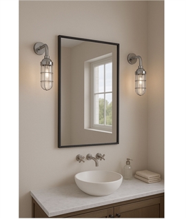Interior wall light with clear glass and aluminium cage. Ideal for themed spaces
