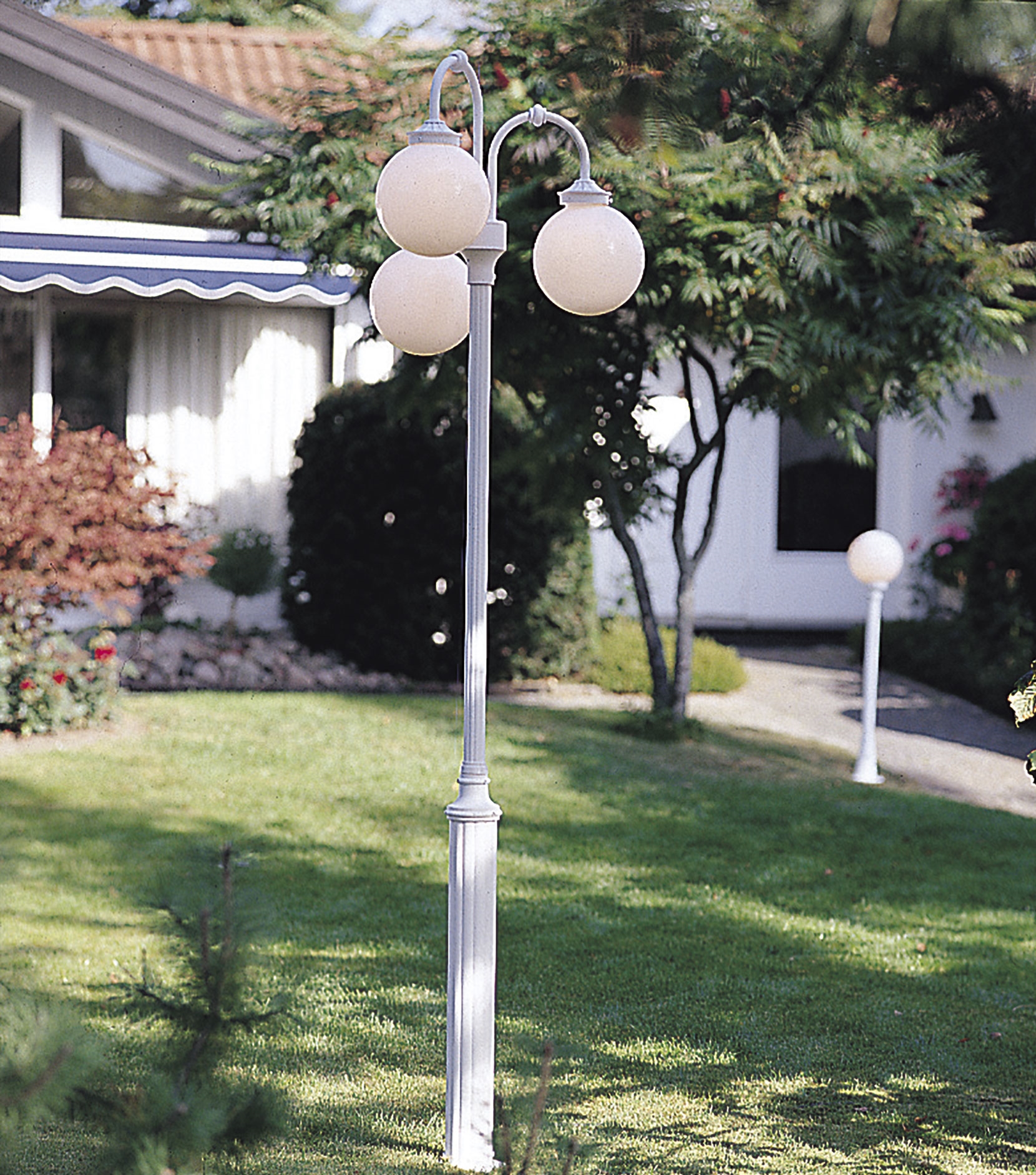 Classical Outdoor Lamp Post with Three Opal Globes on a White Pole