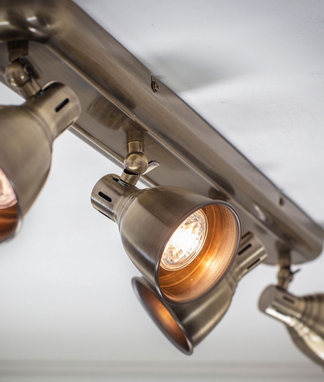 Ceiling 4 Light Adjustable Spot Bar in Antique Brass finish