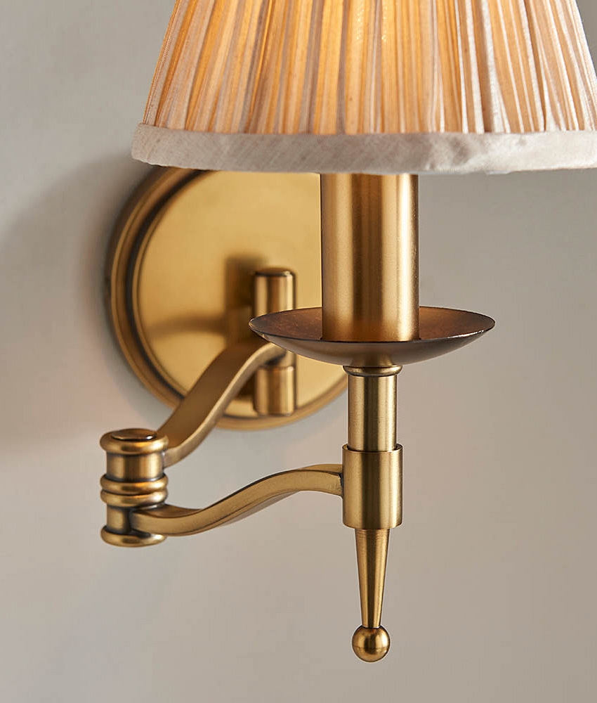 Swing Wall Light in Antique Brass Finish