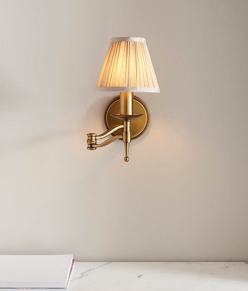 Swing Wall Light in Antique Brass Finish