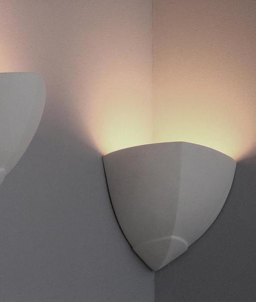 Wall and corner uplight in a pointed corbel design